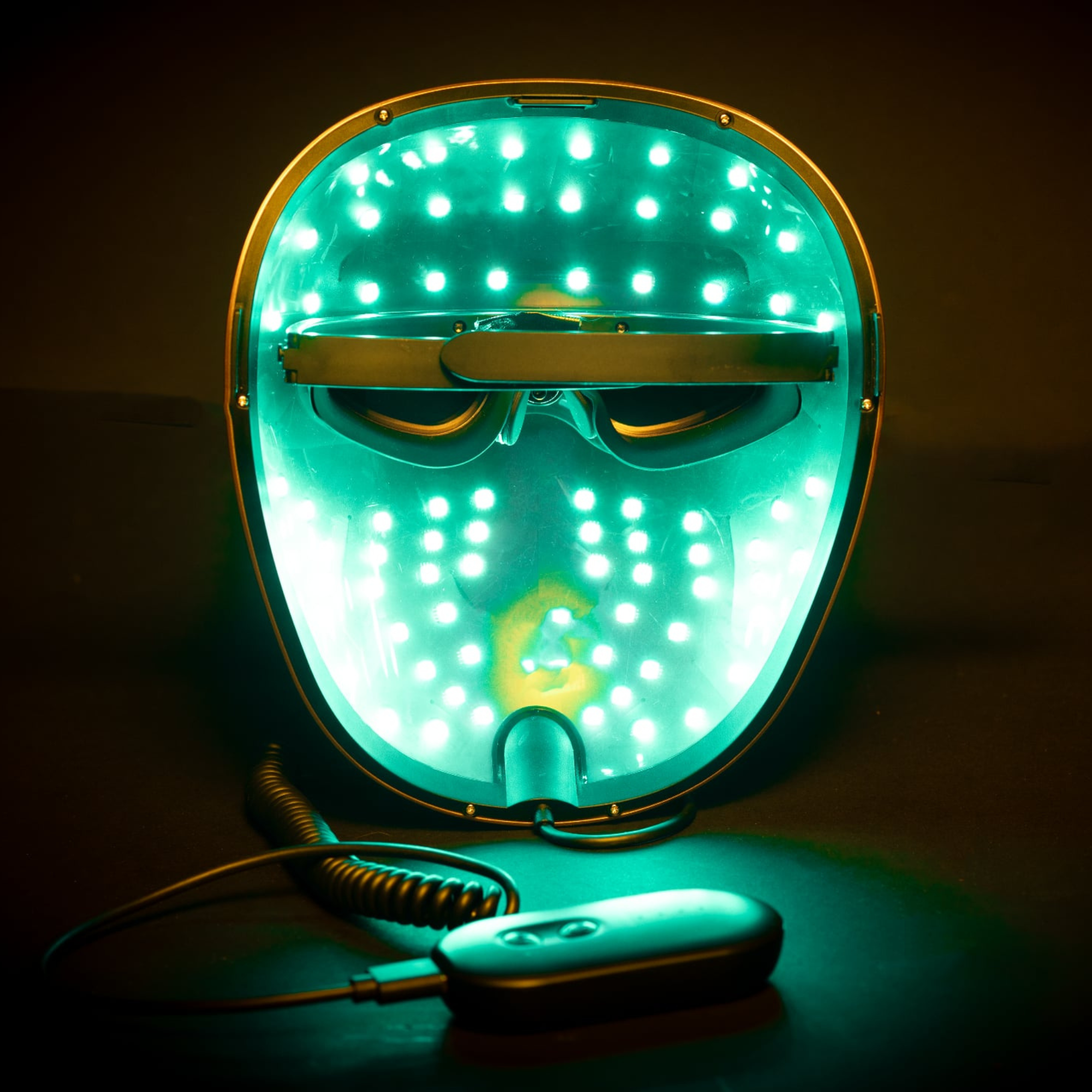picture demonstrates the mask from the inside with the cyan led colour setting on with the controller nearby