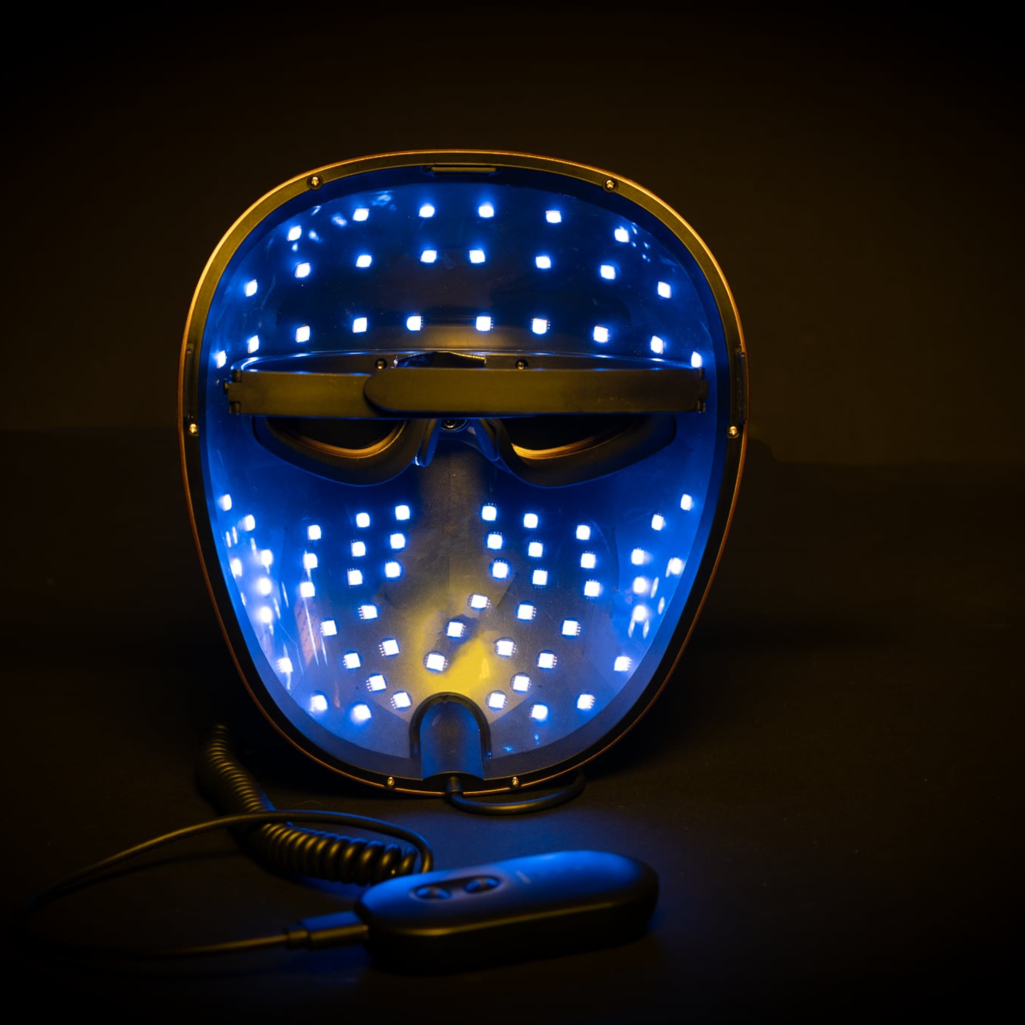 picture shows the inside of the mask with the blue led colours on with controller near by