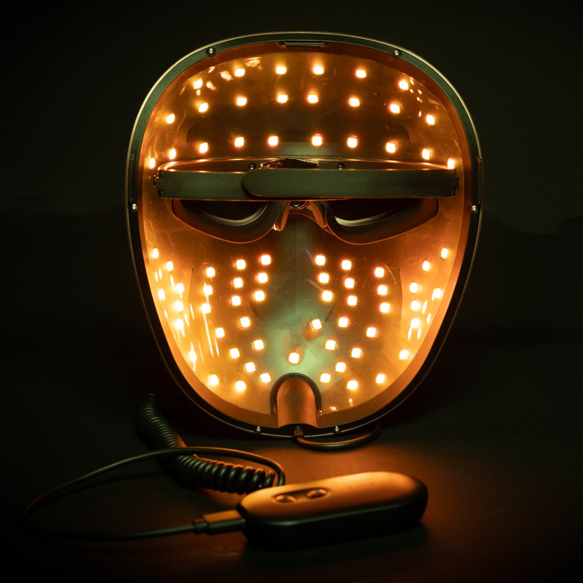 picture shows the inside of the mask with the orange colour demonstrated with the controller nearby