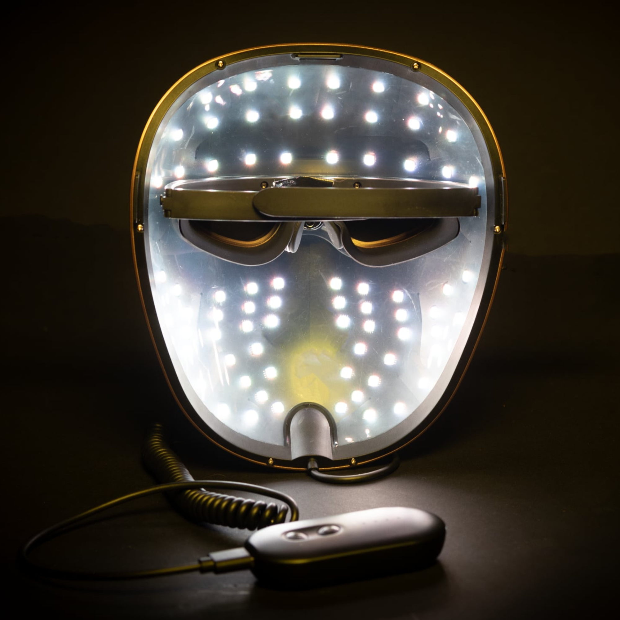 image shows the mask with the white led light on and controler